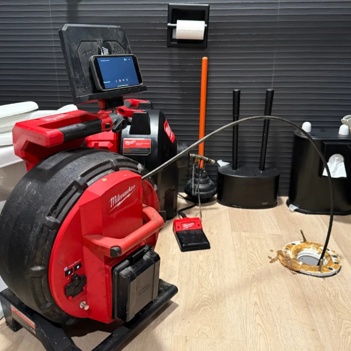 Licensed NSP Plumbing technician inspecting pipes with camera equipment in a Grand Rapids home for lead compliance.