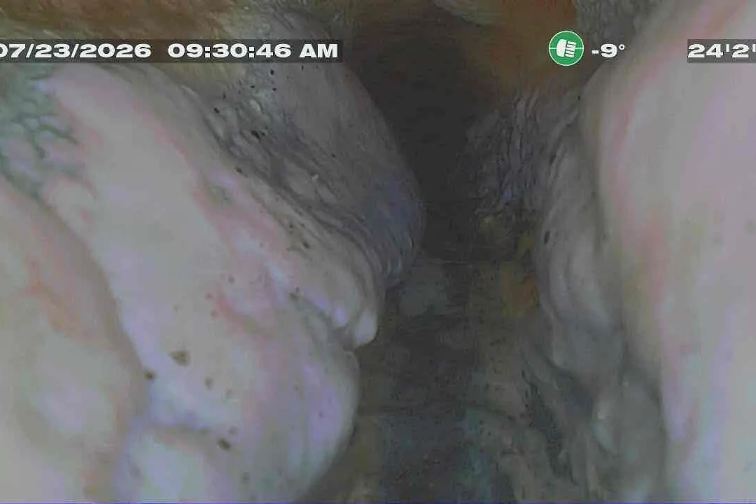 Sewer camera view of a crumbling pipe and a shifted joint 24 feet 2 inches down a West Michigan sewer line