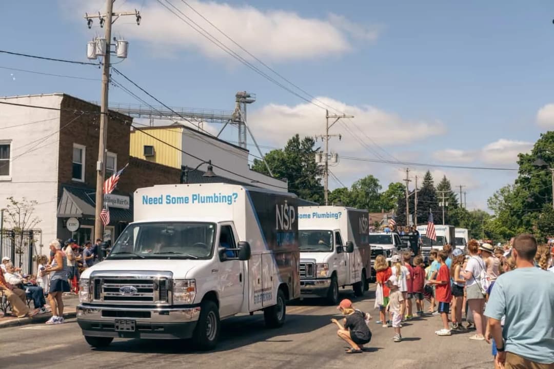 NSP Plumbing service van arriving for an emergency sewer backup call in Grand Rapids, Michigan.