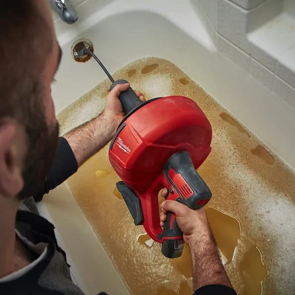 Professional residential drain cleaning service clearing clogged sink in Grand Rapids, MI