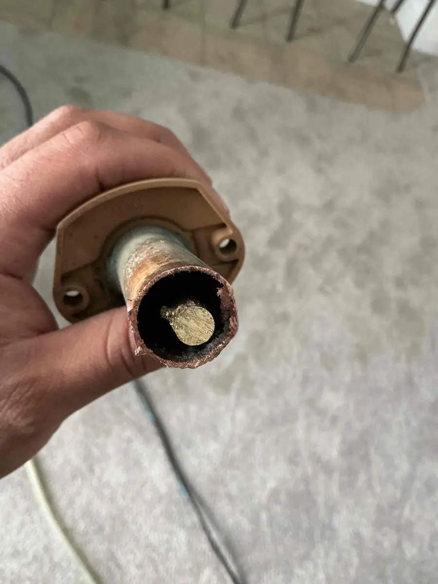 Inside end of a frost free faucet tube with a damaged copper end