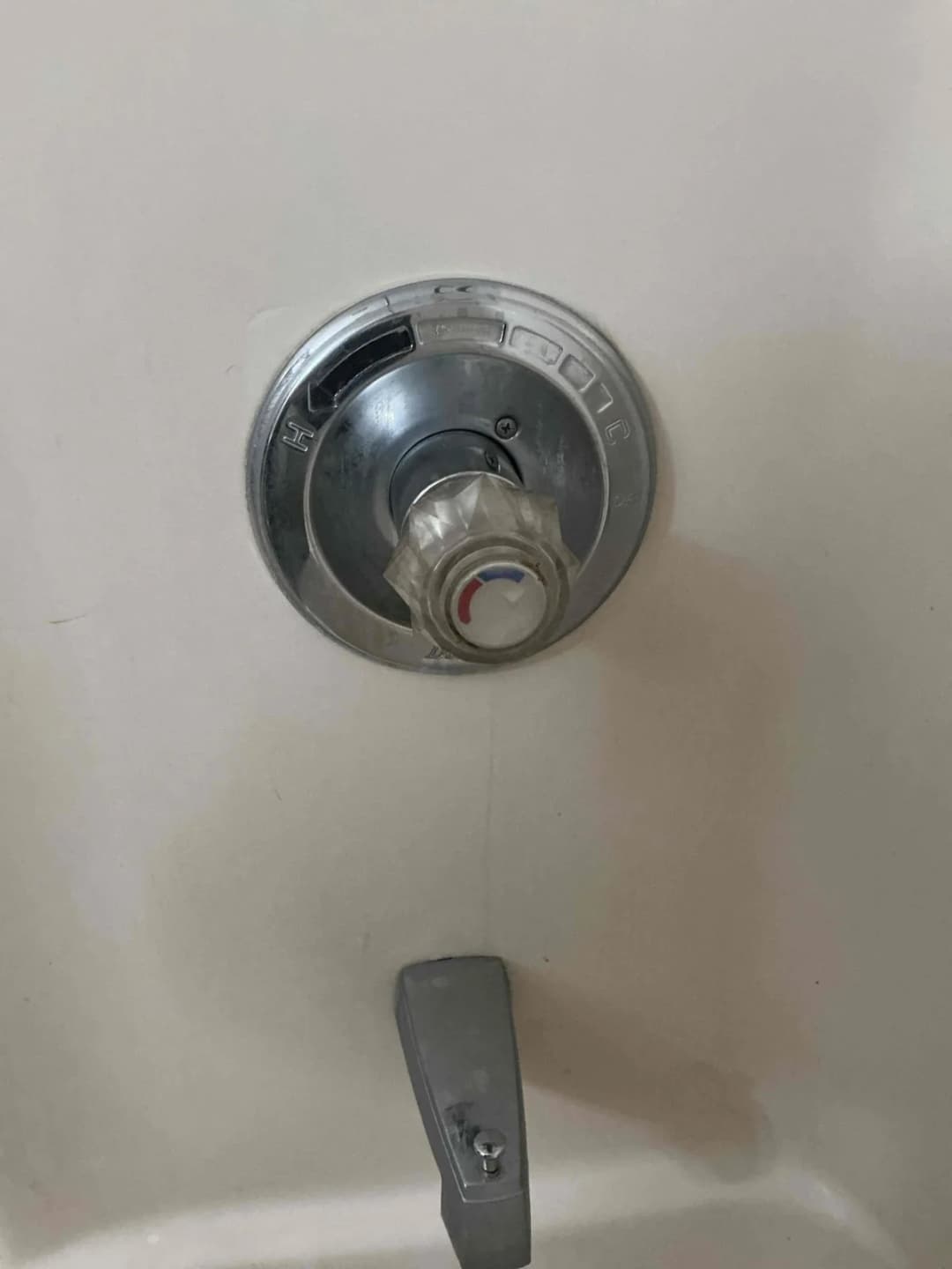 Shower valve with the handle removed showing the cartridge stem and sleeve