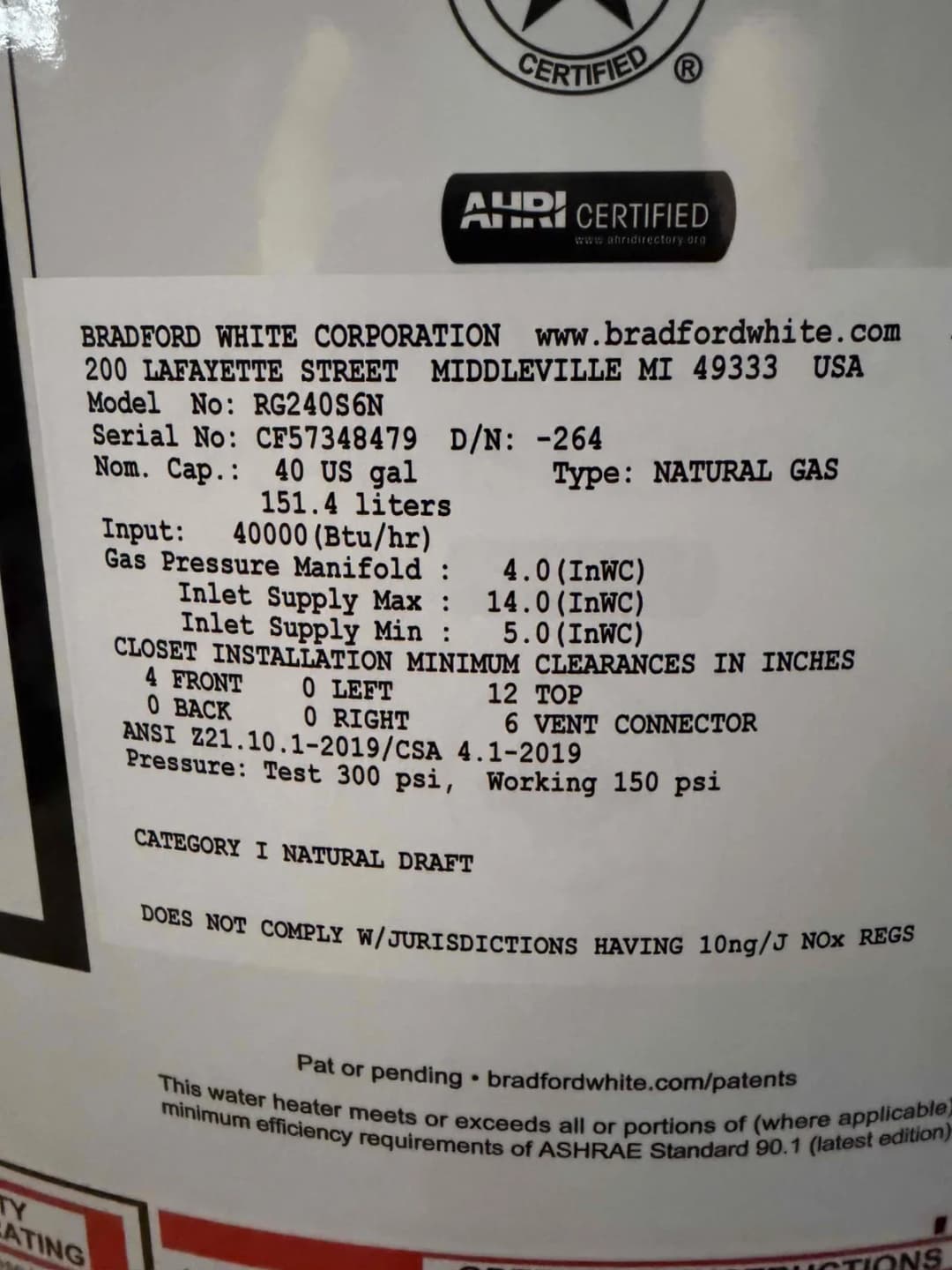 Bradford White water heater data plate showing the model number and serial number used to determine the unit's age
